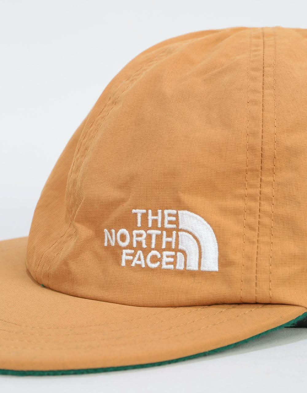 The North Face Reversible Fleece Norm Cap - Cedar Brown/Night Green